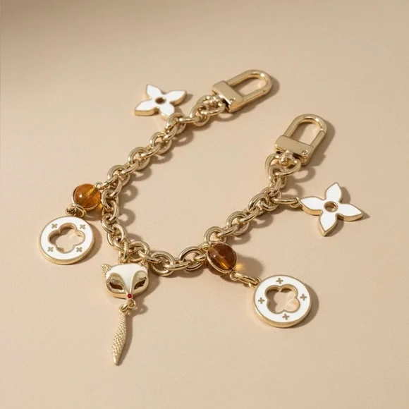 Gold and White Bag Charm with Floral Accents - Picture 1 of 1